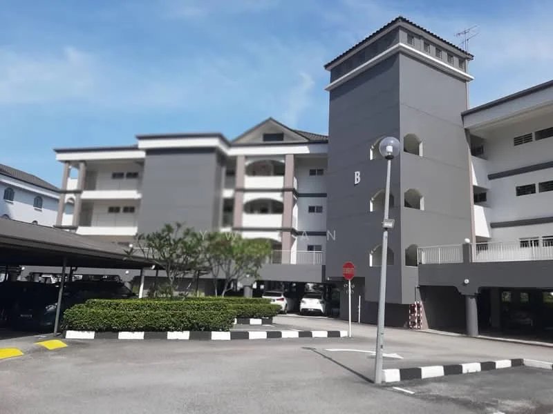 Exterior type: low-rise apartment block; features: grey painted facade, 3-storey low-rise, covered parking area, landscaped garden with shrubs, multiple balconies, tower feature with signage, street lighting, parking lot with marked bays; style: modern.