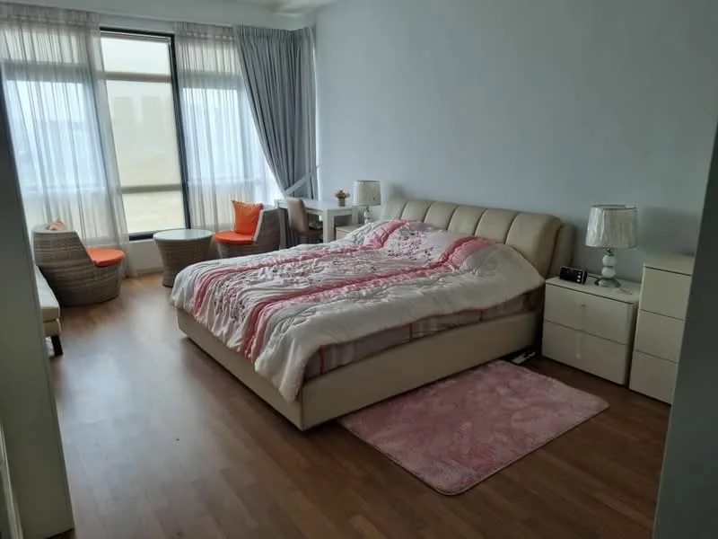Bedroom features: king-size bed with upholstered headboard, white bedding with pink and red stripes, two bedside lamps with fabric shades, wooden flooring, large window with sheer curtains, two accent chairs in rattan, small side table, pink area rug, dresser with multiple drawers; style: modern; view: city.