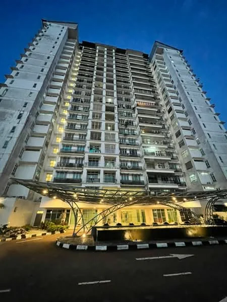 Exterior type: high-rise condominium; features: white painted facade, glass balcony railings, multiple floors visible, outdoor lighting, covered entrance with awning, landscaped area with water feature, parking area in front, modern architectural design; style: modern.