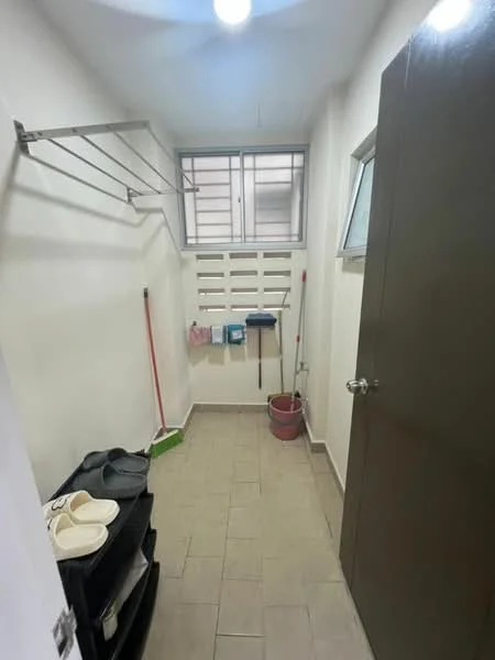 Laundry features: tile flooring, white painted walls, ceiling light, window for natural light, clothes drying rack, cleaning supplies, sweeping broom, bucket, shelves for storage, door to another room.