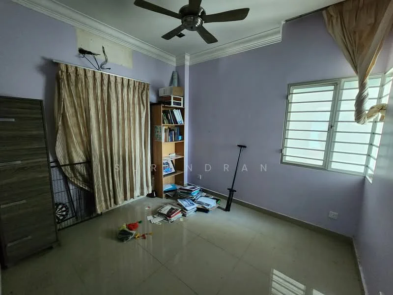 Room features: purple painted walls, glossy tile flooring, ceiling fan, window with horizontal slats, curtains, bookshelf, messy floor with scattered books, wall-mounted shelf, light source from window.