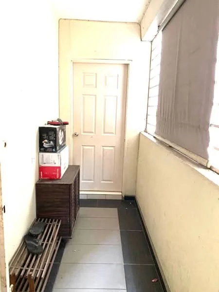 Room features: cream painted walls, grey tiled flooring, wooden storage bench, white door, window with grey blinds, light source from window, minimal decor; style: minimalist.