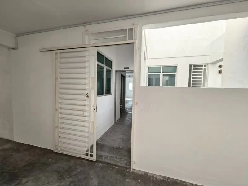 Room features: white walls, concrete flooring, sliding metal door, large windows, doorway leading to another room, natural light from windows, minimalist design, open layout; style: modern.