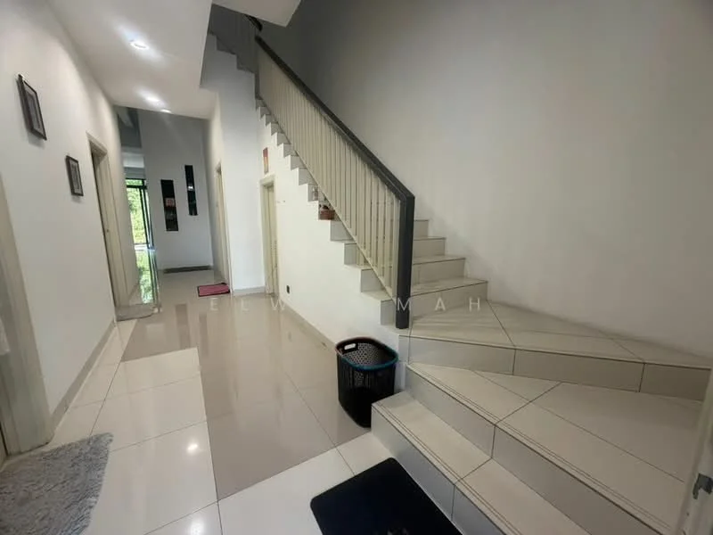Hallway features: white painted walls, glossy ceramic tile flooring, staircase with tiled steps, handrail on staircase, recessed lighting, doorway leading to other rooms, decorative wall frames, waste bin; style: modern.