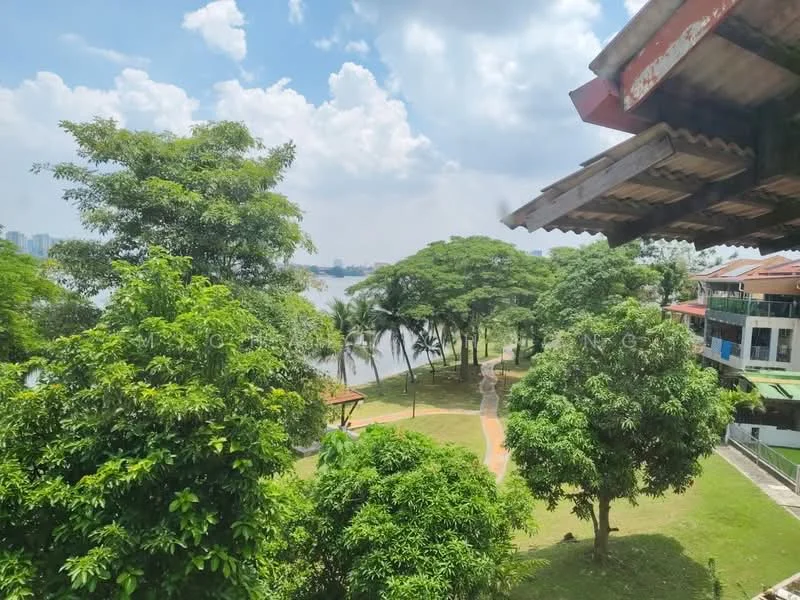 Exterior features: lush greenery, mature trees, waterfront view, park area, walking path, open sky, residential buildings in background.