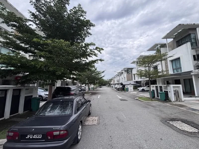 Exterior type: linked terrace house; features: paved road, street lined with trees, two-storey houses, garbage bins visible, car parked on the street, sidewalks, cloudy sky; style: modern.