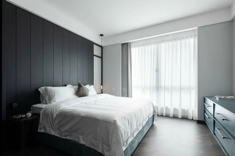 Bedroom features: king-size bed with white bedding, dark wood accent wall, light grey walls, floor-to-ceiling window with sheer curtains, dark wood flooring, nightstand with round lamp, blue dresser, decorative items on dresser; style: modern.