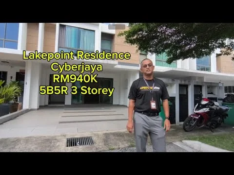 Exterior type: 3-storey low-rise; features: modern facade with cream and brown accents, covered parking area, manicured lawn, paved walkway, multiple balconies, large windows, entrance with overhang, surrounded by greenery; style: modern.