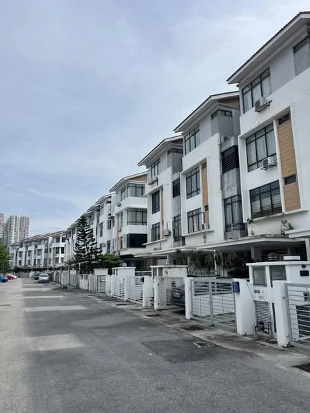 Exterior type: linked terrace house; features: white painted facade, wooden accents, multiple storeys, balconies on upper floors, air conditioning units visible, driveway with interlocking pavers, manicured landscaping, gated entry, parking spaces visible, surrounded by residential area; style: modern.