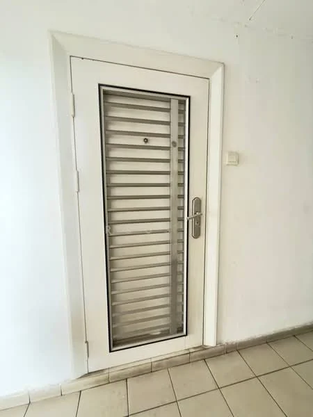 Room features: white painted walls, tiled flooring, glass door with horizontal slats, metal door handle, door frame with white finish.