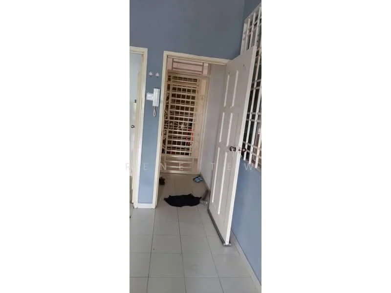 Room features: light blue painted walls, white tiled flooring, white doors, metal security grille on door, door frame, visible hallway, clothing on the floor.