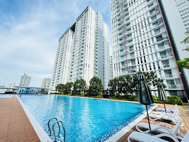 Exterior type: high-rise condominium; features: infinity pool, pool deck with loungers, landscaped garden, surrounded by mature trees, glass curtain wall facade, multiple storeys, outdoor umbrellas, wooden decking; style: modern.