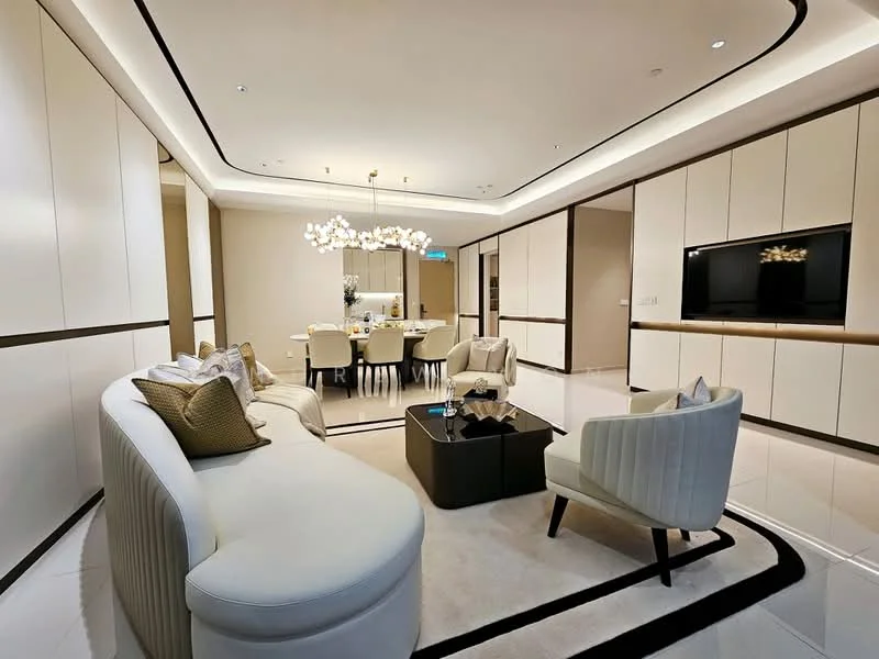 Living features: curved white fabric sofa, black coffee table, chandelier with multiple bulbs, recessed ceiling lights, white walls with wood accents, marble flooring, area rug with geometric pattern, wall-mounted TV unit, dining area visible in background, upholstered dining chairs, 6-seater dining table, decorative vases on dining table; style: modern.