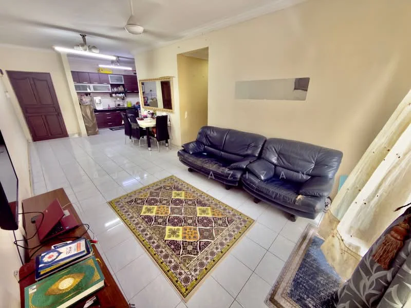 Living features: 3-seater leather sofa in dark blue, coffee table, TV console, wall-mounted TV, area rug with intricate pattern, ceiling fan, white tiled flooring, cream painted walls, window with sheer curtains; style: modern. Kitchen features: open kitchen layout, dark wood cabinetry, stainless-steel sink, built-in oven, 4-burner gas hob, microwave, refrigerator, white tiled backsplash, countertop with space for dining, dining table with chairs; style: modern.