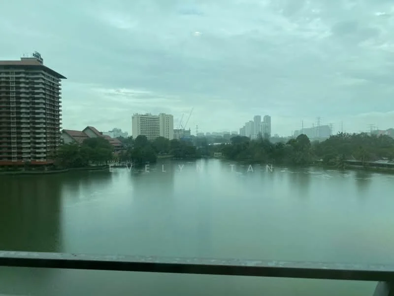 Exterior features: view of a lake, surrounding greenery, city skyline in background, multiple buildings visible, cloudy sky.