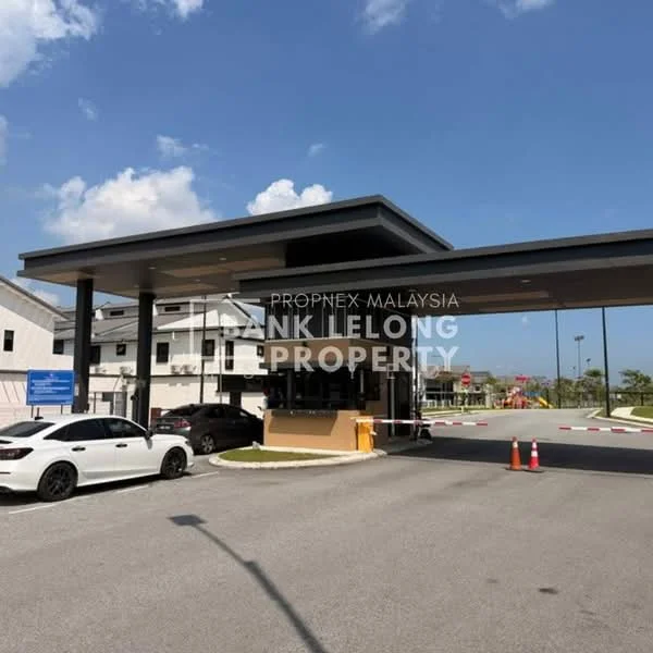 Exterior type: main entrance gate; features: modern guard house, covered entrance, security booth, paved driveway, traffic cones, landscaped surroundings, signage visible, surveillance cameras, gated entry; style: modern.