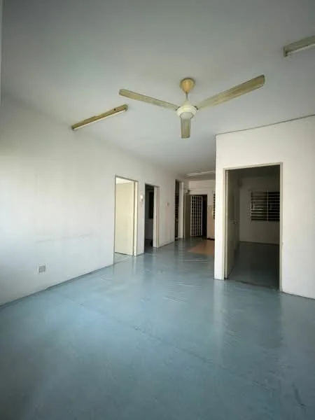 Room features: white painted walls, polished concrete flooring, ceiling fan, doorway leading to another room, doorway leading to hallway, window with security bars, natural light from window.