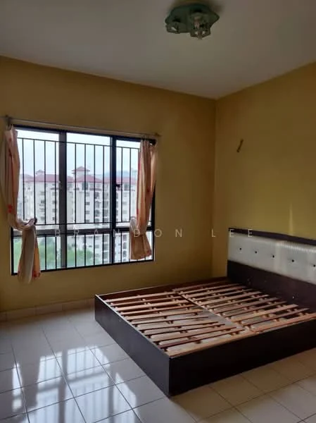 Bedroom features: yellow painted walls, white tiled flooring, large window with black metal grille, curtains with floral pattern, wooden bed frame without mattress, ceiling light fixture, view of neighboring buildings; view: city.
