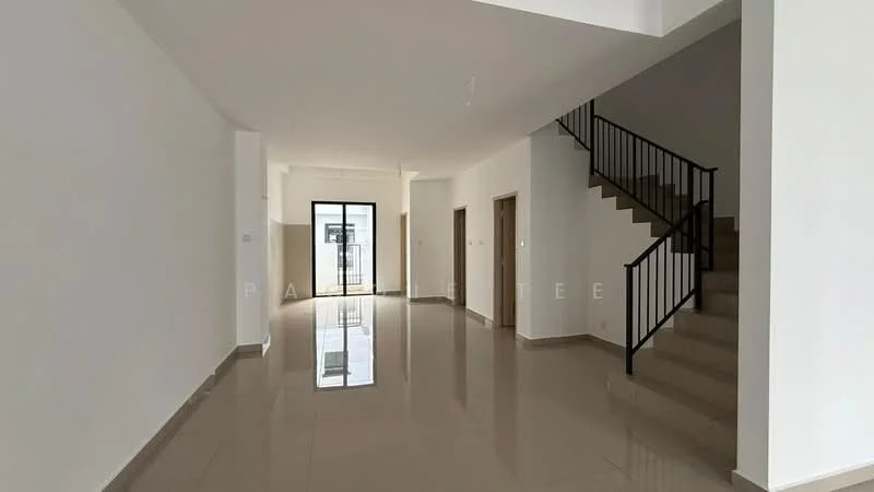 Room features: white painted walls, glossy beige tile flooring, staircase with black metal railing, large glass door leading to outdoor area, natural light from large windows, open layout, high ceiling, neutral color scheme; style: modern.