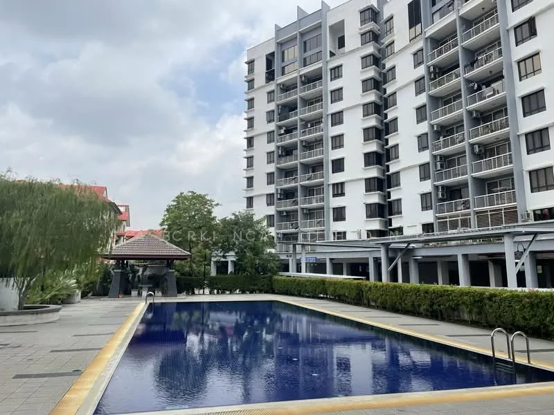Exterior type: mid-rise condominium; features: infinity pool, pool deck with loungers, landscaped garden, manicured lawn, surrounded by greenery, multiple balconies, glass curtain wall, white painted facade; style: modern.