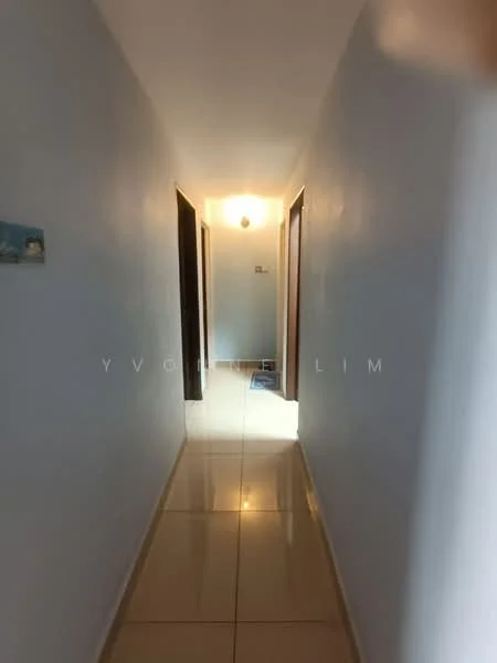 Hallway features: white painted walls, glossy tile flooring, ceiling light fixture, wooden doors, natural light from end of hallway.