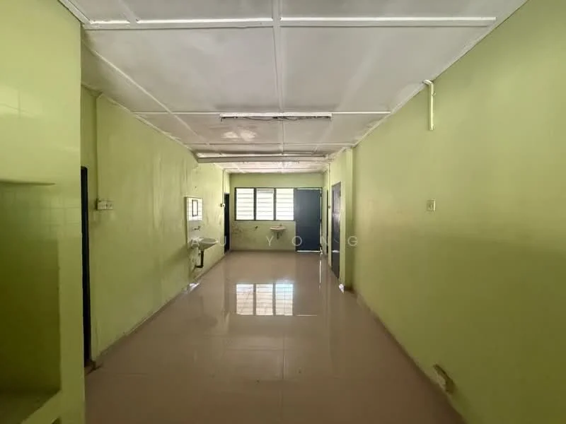 Room features: green painted walls, white ceiling, tile flooring, window with multiple panes, doorway leading to another room, sink with faucet, open layout, natural light from windows.