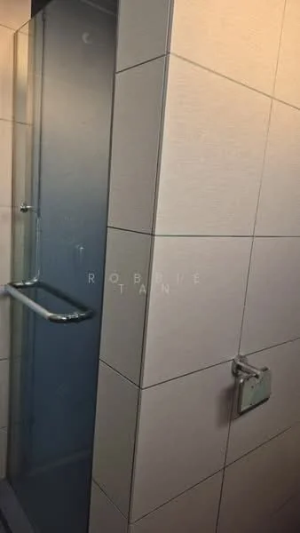 Bathroom features: glass shower enclosure, chrome shower handle, white tiled walls, grey grout, built-in shower shelf, non-slip floor tiles, modern faucet, wall-mounted towel holder; style: modern.