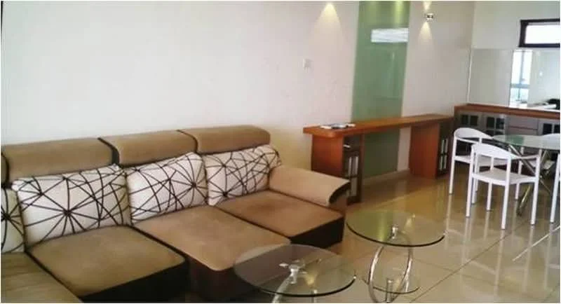 Living features: 3-seater fabric sofa in beige with geometric pattern, 2 glass coffee tables, cream tiled flooring, white painted walls, recessed downlights, wooden console table, dining table with white chairs, large window with natural light; style: modern.