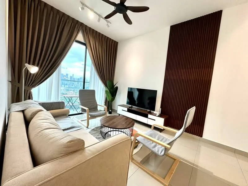 Living features: beige fabric sofa, wooden coffee table, 2 armchairs with light wood frames, floor-to-ceiling windows, curtains in dark brown, wood panel accent wall in dark brown, wall-mounted TV, white TV console, recessed ceiling lights, 5-blade ceiling fan, tile flooring in light color, decorative plant in corner; style: modern; view: city.