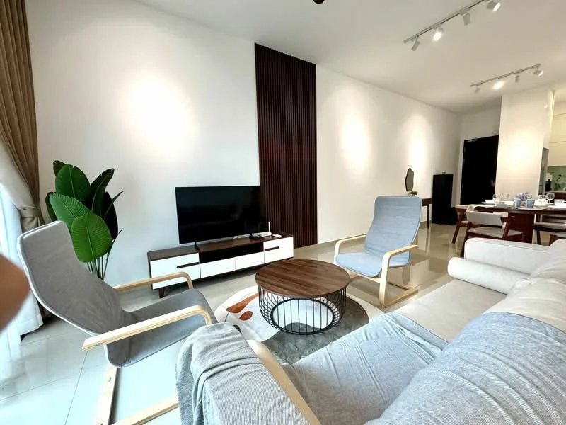 Living features: light grey fabric sofa, 2 grey armchairs with wooden frames, round wooden coffee table, TV console with white cabinetry, wall-mounted flat-screen TV, decorative wall paneling, recessed ceiling lights, large window with sheer curtains, indoor plant, area rug with geometric pattern, dining area visible in background; style: modern.