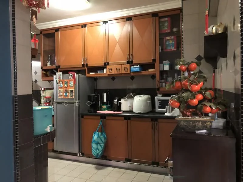 Kitchen features: brown wooden cabinetry, black countertop, stainless-steel fridge, microwave, rice cooker, coffee machine, kettle, decorative orange plant, tile flooring, wall-mounted shelves, wall clock, decorative items on shelves; style: traditional.