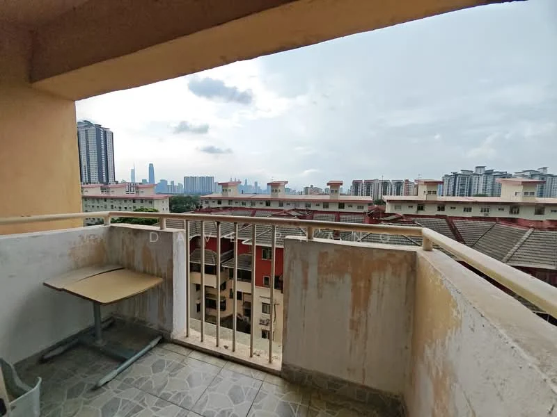 Balcony features: concrete flooring, metal railing, table, chair, city skyline view, overcast sky; view: city.