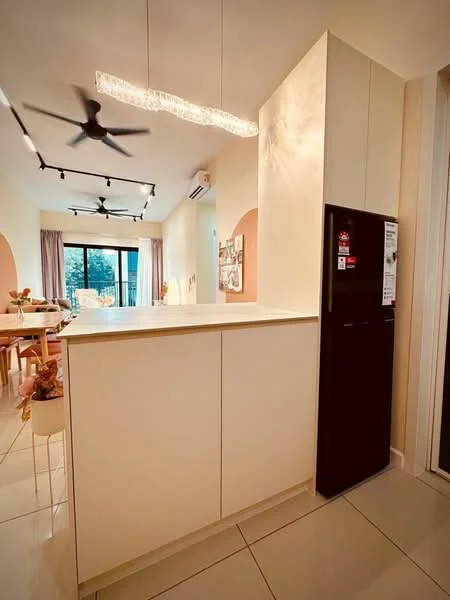 Kitchen features: white cabinetry, countertop with integrated lighting, stainless-steel fridge, pendant lighting, 5-blade ceiling fan, open-plan layout, tile flooring, window with view to outdoor space, dining area visible in background, light-colored walls, recessed lighting; style: modern; view: garden.