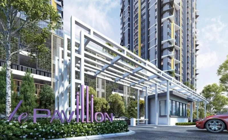 Exterior type: high-rise condominium; features: modern facade with glass and concrete, covered entrance with white structural elements, landscaped greenery with trees and shrubs, prominent signage with 'le Pavillion', driveway with smooth paving, parking area visible, surrounding urban context, multiple storeys visible; style: modern.