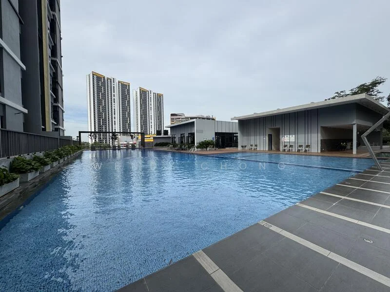 Exterior type: high-rise condominium; features: infinity pool, pool deck with loungers, surrounding landscaping with planters, modern clubhouse, tall residential buildings in background, paved walkway around pool; style: modern.