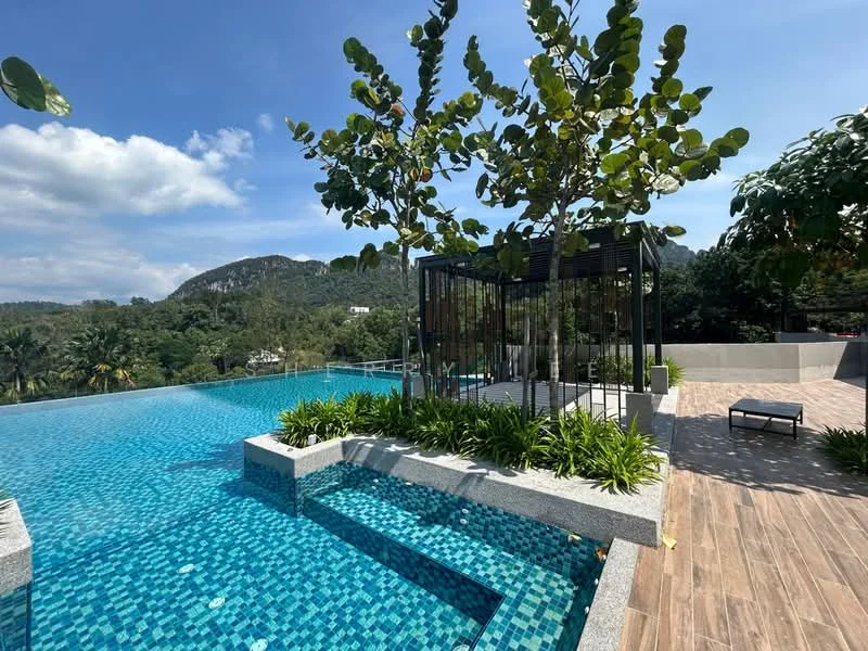 Exterior type: swimming pool deck; features: infinity pool, mosaic tile pool flooring in blue, surrounding landscaped garden with greenery, trees planted near the pool area, deck area with wooden flooring, mountain view in background, lounge chair beside the pool; style: modern.