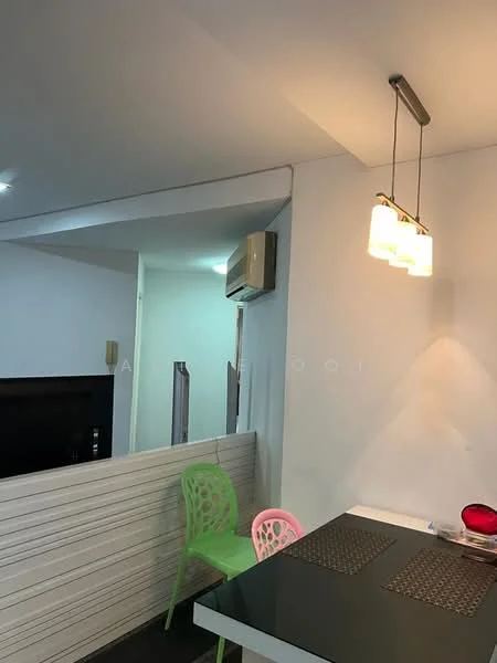 Room features: white painted walls, black countertop, pendant light fixture, 2 dining chairs in green and pink, wall-mounted split AC, dark flooring, TV console, recessed lighting; style: modern.
