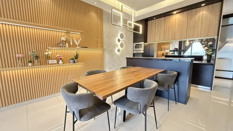 Dining features: wood dining table, 4 upholstered dining chairs in grey, wooden feature wall with vertical slats, recessed lighting, decorative shelving with plants and decor items, kitchen counter with built-in appliances, mirror backsplash, pendant lighting fixtures; style: modern.