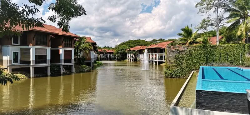 Exterior type: linked terrace house; features: waterfront view, fountain in water, swimming pool with deck, landscaped garden, palm trees, red tiled roofs, manicured greenery, surrounding water body; style: tropical-modern.