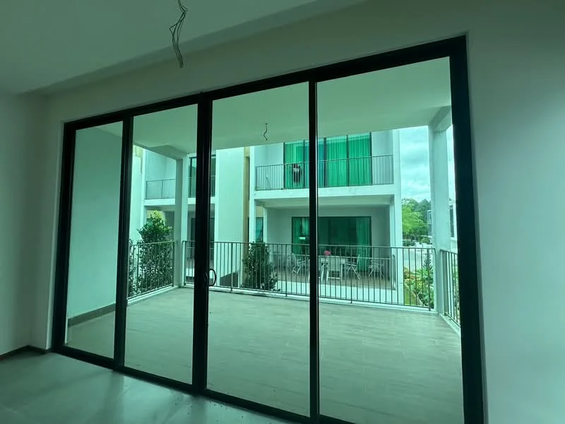 Room features: floor-to-ceiling sliding glass doors, balcony with railing, green view from balcony, neutral wall color, tile flooring, natural light from large windows, outdoor seating area visible, access to outdoor space; style: modern; view: garden.