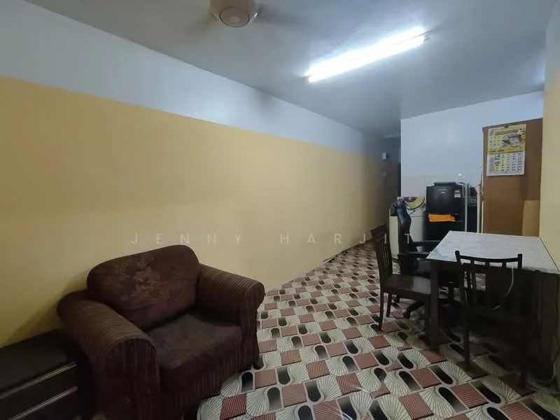 Living features: brown striped fabric sofa, dining table with four chairs, tile flooring with geometric pattern, yellow painted walls, white ceiling, ceiling fan, wall-mounted TV, refrigerator, calendar on wall, light fixtures.