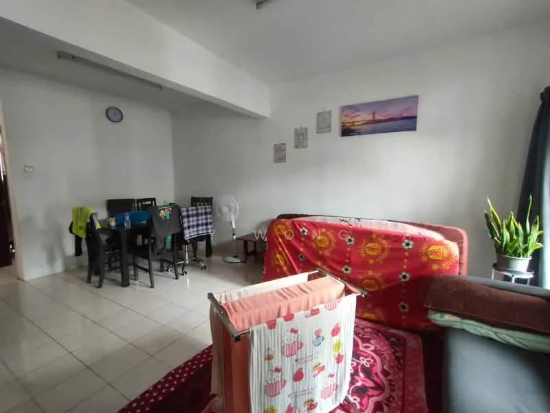 Living features: white painted walls, tile flooring, sofa with red and floral pattern, area rug with geometric pattern, potted plant, wall clock, framed artwork, ceiling fan. Dining features: 4-seater dining table, black dining chairs, tablecloth with checkered pattern.
