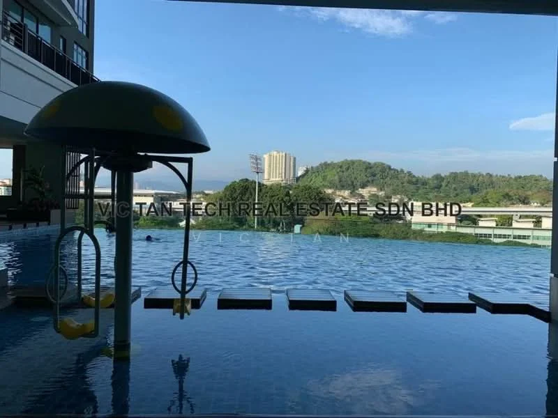 Exterior type: swimming pool deck; features: infinity pool, pool deck with loungers, children's water play area with mushroom fountain, surrounded by greenery, city skyline in background, clear blue sky; style: modern.