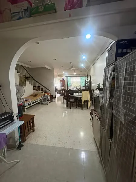 Living features: tile flooring, white walls, ceiling fan, dining table with chairs, sofa, refrigerator, open layout, natural light from windows, decorative plants, staircase in background; style: modern.