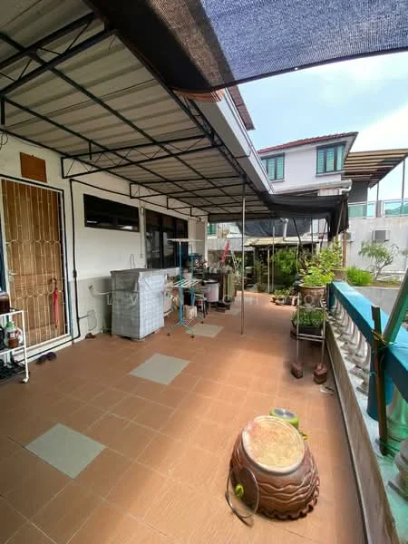Room features: tiled flooring in brown, metal roof with awning, outdoor kitchen area with sink, metal shelving unit, potted plants, decorative ceramic pots, open space layout, fenced perimeter, outdoor dining area, garden view; style: modern; view: garden.