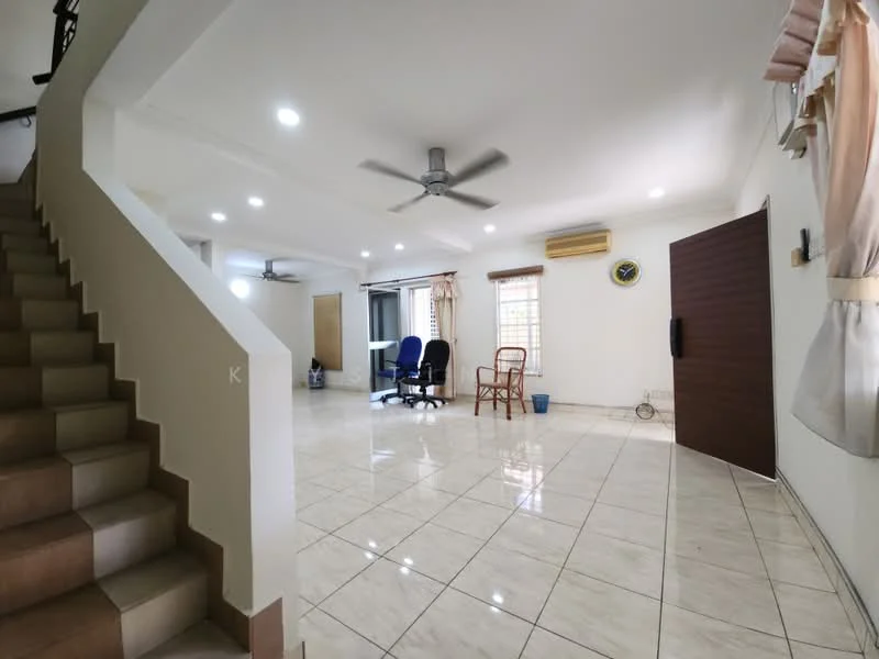Living features: white painted walls, glossy tile flooring, 5-blade ceiling fan, recessed downlights, large windows, curtains, wooden door, air conditioning unit, seating area with chairs, desk with office chairs; style: modern. Hallway features: white painted walls, glossy tile flooring, staircase with beige tiles, handrail, recessed downlights; style: modern.