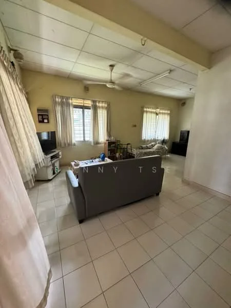 Living features: 3-seater fabric sofa in grey, coffee table, TV console, wall-mounted TV, floor-to-ceiling windows, sheer curtains, ceiling fan, white painted walls, tile flooring, area rug, decorative items on coffee table.