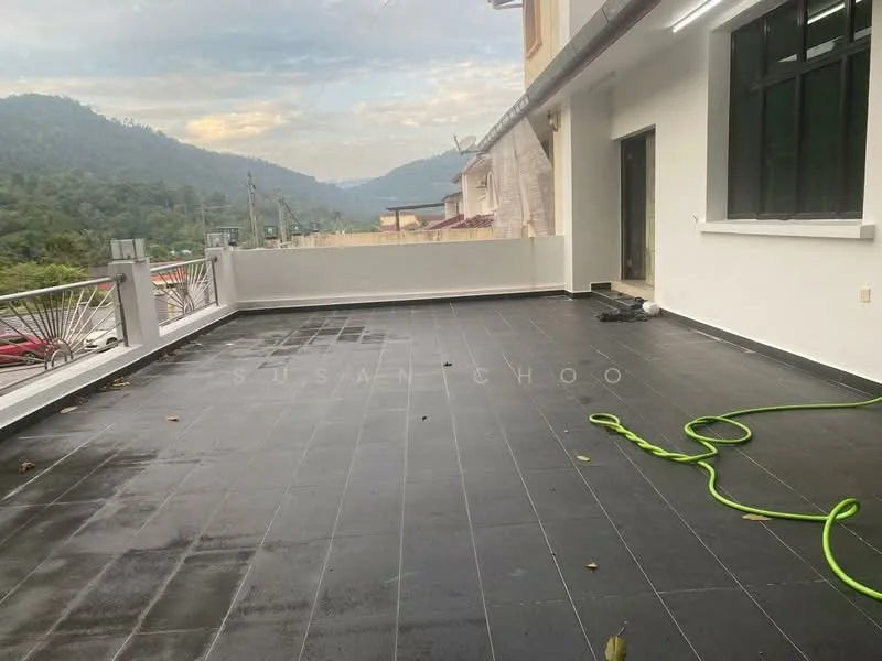 Exterior features: large outdoor terrace, black tiled flooring, mountain view, railing along the edge, outdoor hose, partially covered area, surrounded by greenery; style: modern.