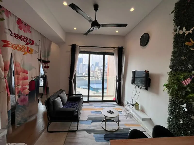 Living features: 5-blade ceiling fan with light, floor-to-ceiling windows, sliding glass door, blackout curtains, wall-mounted TV, sofa in black fabric, coffee table, area rug with geometric pattern, decorative wall with floral design, greenery wall decor, clock on wall, wooden flooring; style: modern; view: city.