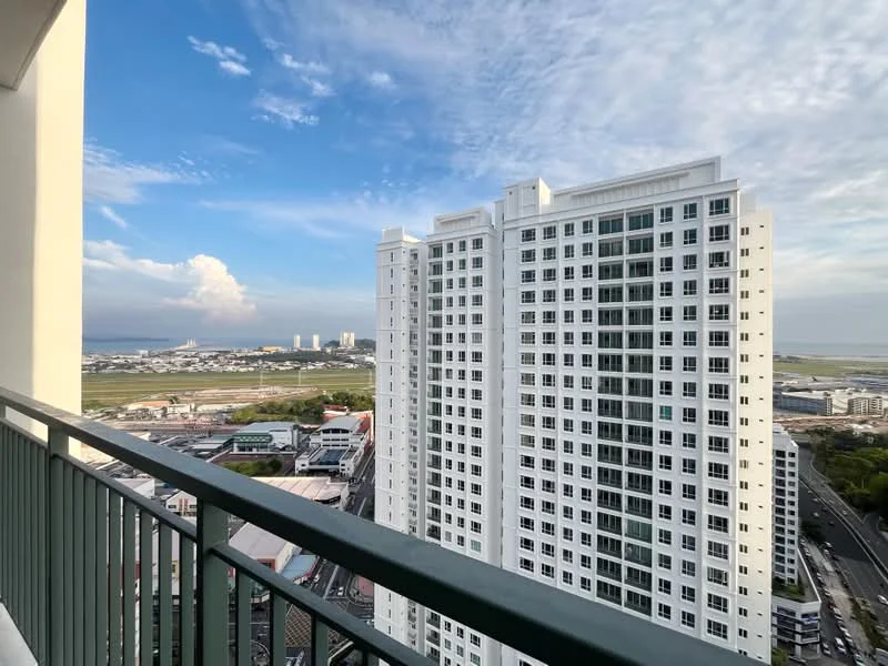 Exterior type: high-rise condominium; features: white painted facade, glass curtain wall, approximately 20-storey high-rise, surrounded by urban landscape, view of city skyline, balcony railing, cloudy sky, distant industrial area; style: modern.